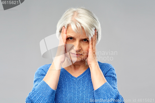 Image of senior woman suffering from headache