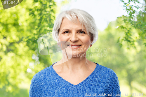 Image of portrait of smiling senior woman in blue sweater