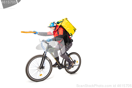 Image of Too much orders. Contacless delivery service during quarantine. Man delivers food and shopping bags during isolation, wearing gloves and face mask.