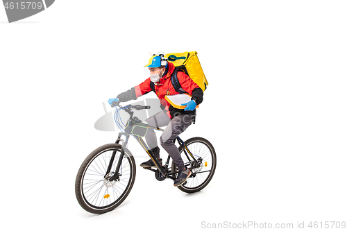 Image of Too much orders. Contacless delivery service during quarantine. Man delivers food and shopping bags during isolation, wearing gloves and face mask.