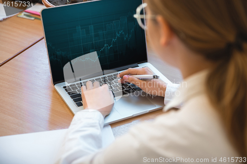 Image of Caucasian entrepreneur, businesswoman, manager working concentrated in office, close up, focus on hands