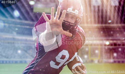 Image of portrait of confident American football player