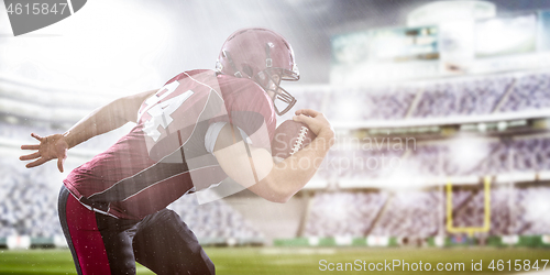 Image of American football Player running with the ball