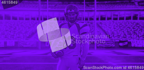 Image of duo toned american football player in  arena at night