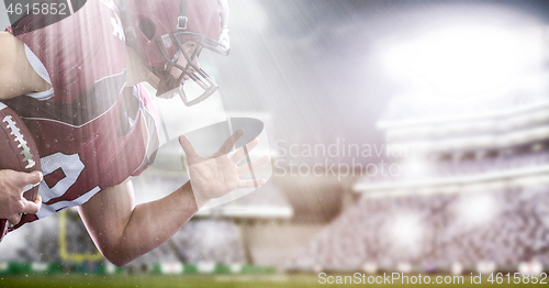 Image of American football Player running with the ball