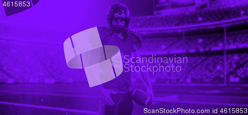 Image of duo toned american football player in  arena at night