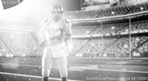 Image of American Football Player isolated on big modern stadium field