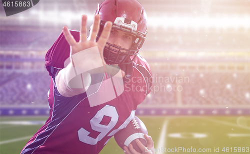 Image of portrait of confident American football player