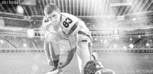 Image of American Football Player on big modern stadium field