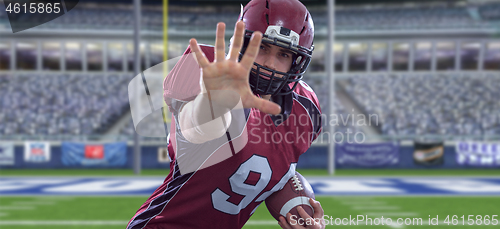 Image of portrait of confident American football player