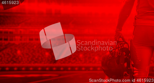 Image of duo toned american football player in  arena at night