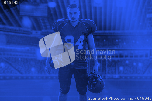 Image of duo toned american football player in  arena at night