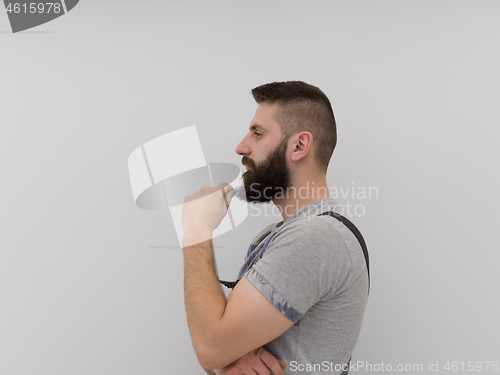 Image of portrait of bearded hipster handyman isolated on white