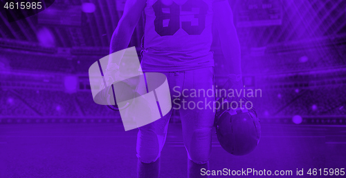 Image of duo toned american football player in  arena at night