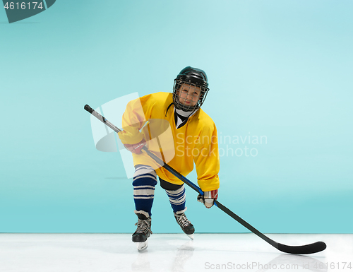 Image of A hockey player with equipment over a blue background