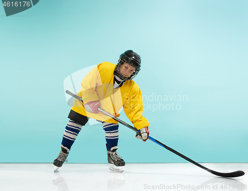 Image of A hockey player with equipment over a blue background