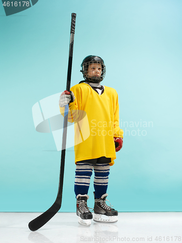 Image of A hockey player with equipment over a blue background