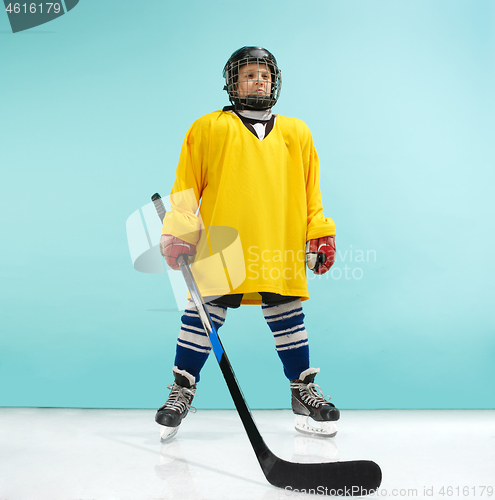 Image of A hockey player with equipment over a blue background