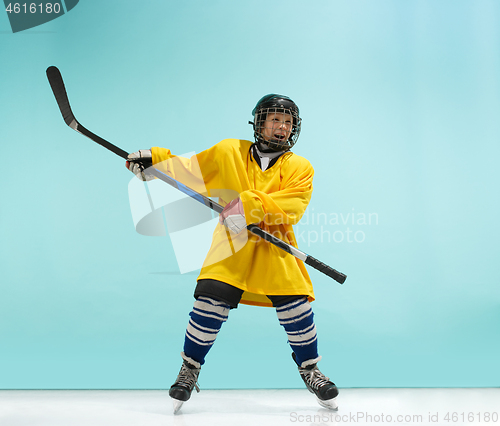 Image of A hockey player with equipment over a blue background