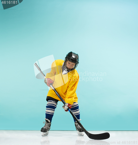 Image of A hockey player with equipment over a blue background