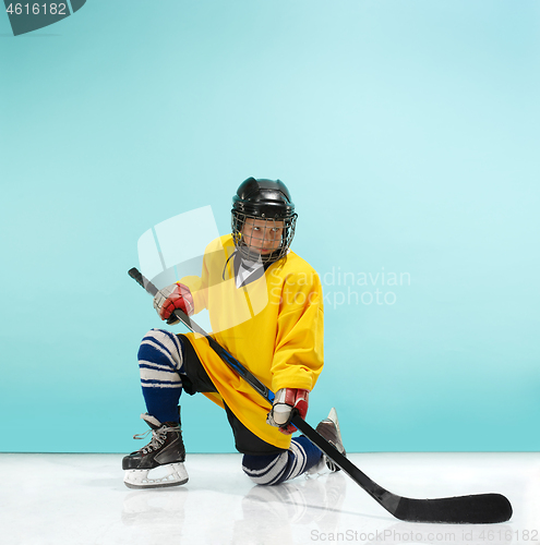 Image of A hockey player with equipment over a blue background