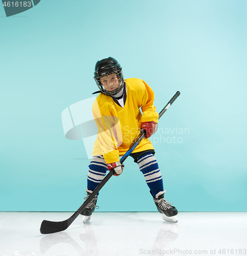 Image of A hockey player with equipment over a blue background