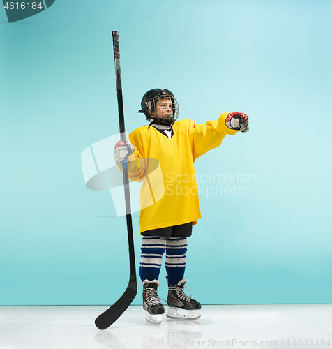 Image of A hockey player with equipment over a blue background