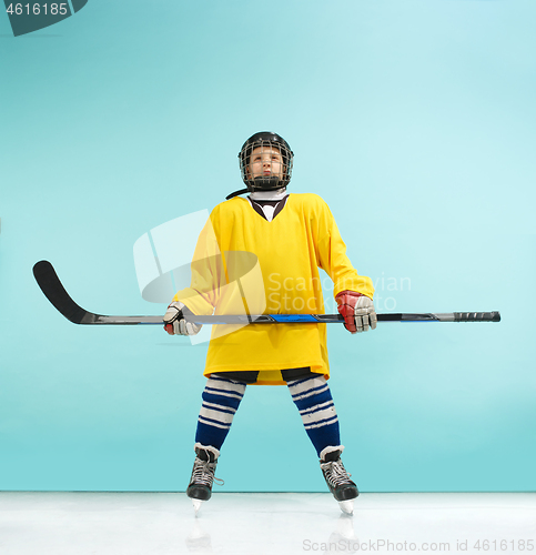 Image of A hockey player with equipment over a blue background