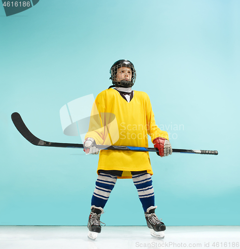 Image of A hockey player with equipment over a blue background