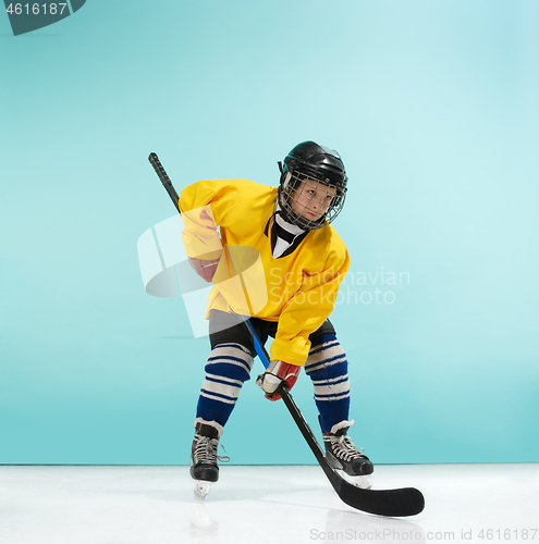 Image of A hockey player with equipment over a blue background