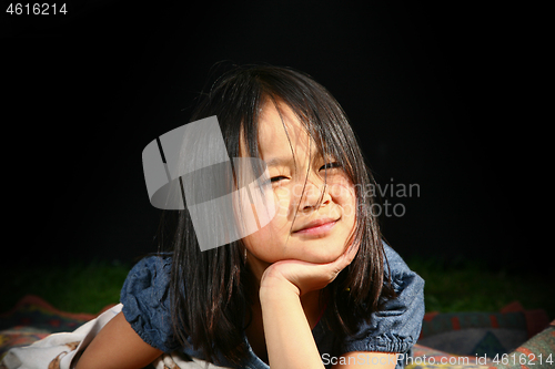 Image of Portrait of a young cute girl looking at the camera