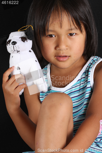 Image of Portrait of a young cute girl looking at the camera