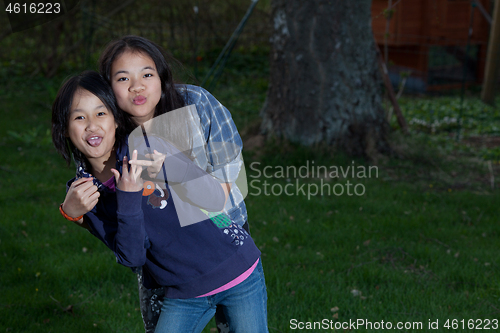 Image of Portrait of a young sisters looking at the camera