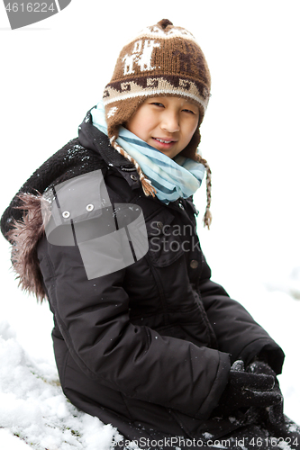 Image of Girl playing in the snow in winter in denmark