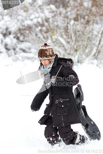 Image of Girl playing in the snow in winter in denmark