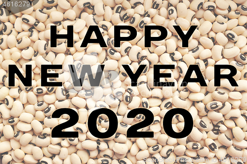 Image of Happy New Year 2020 text over black eyed peas