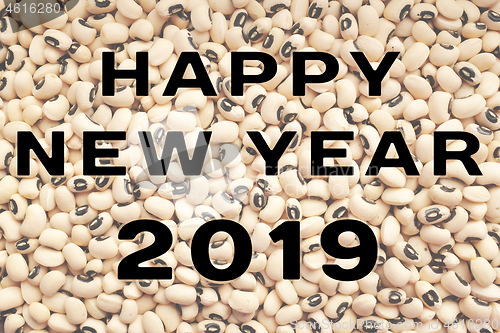 Image of Happy New Year 2019 text over black eyed peas