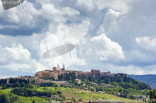 Image of Camerino in Italy Marche over colourful fields
