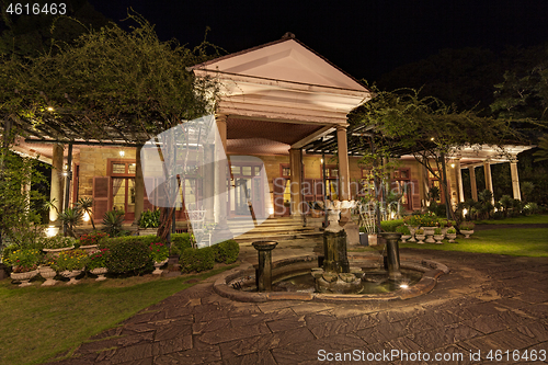 Image of Old classic style vintage home with veranda and garden