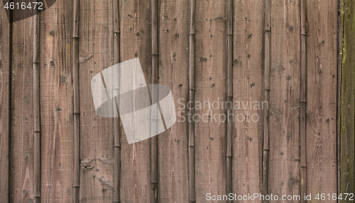 Image of Brown wood texture background divided on vertical planches