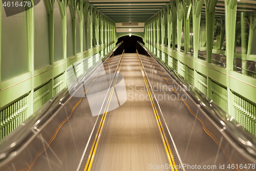 Image of Moving escalator, blurred abstract background