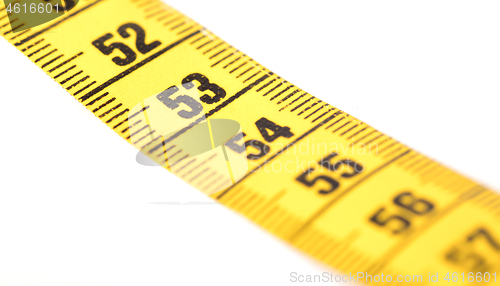 Image of Close-up of a yellow measuring tape isolated on white - 53