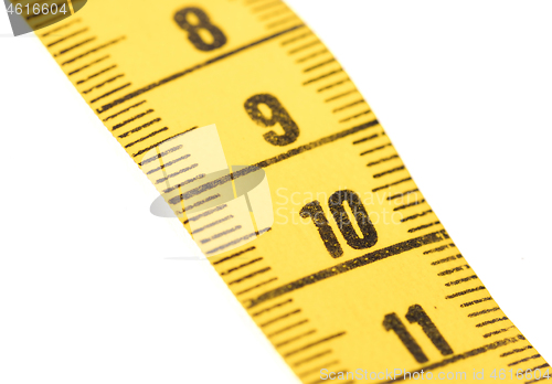 Image of Close-up of a yellow measuring tape isolated on white - 10