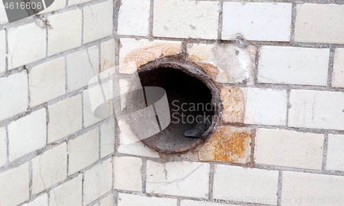 Image of Old small tiles square shape on a wall