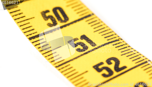 Image of Close-up of a yellow measuring tape isolated on white - 51
