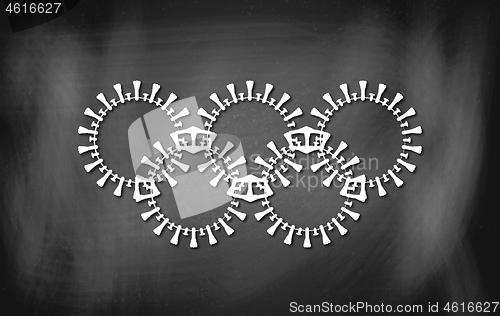 Image of The Olympic circles illustrated as a pathogen of the coronavirus