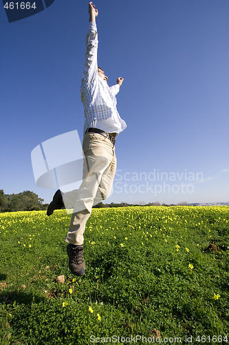 Image of man jumping high to sucess