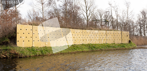 Image of Wall with holes, nests for swallows