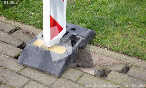 Image of Pavement of paving slabs, requiring repair