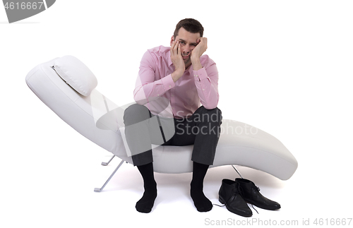 Image of Man client sitting with psychologist on the comfortable couch